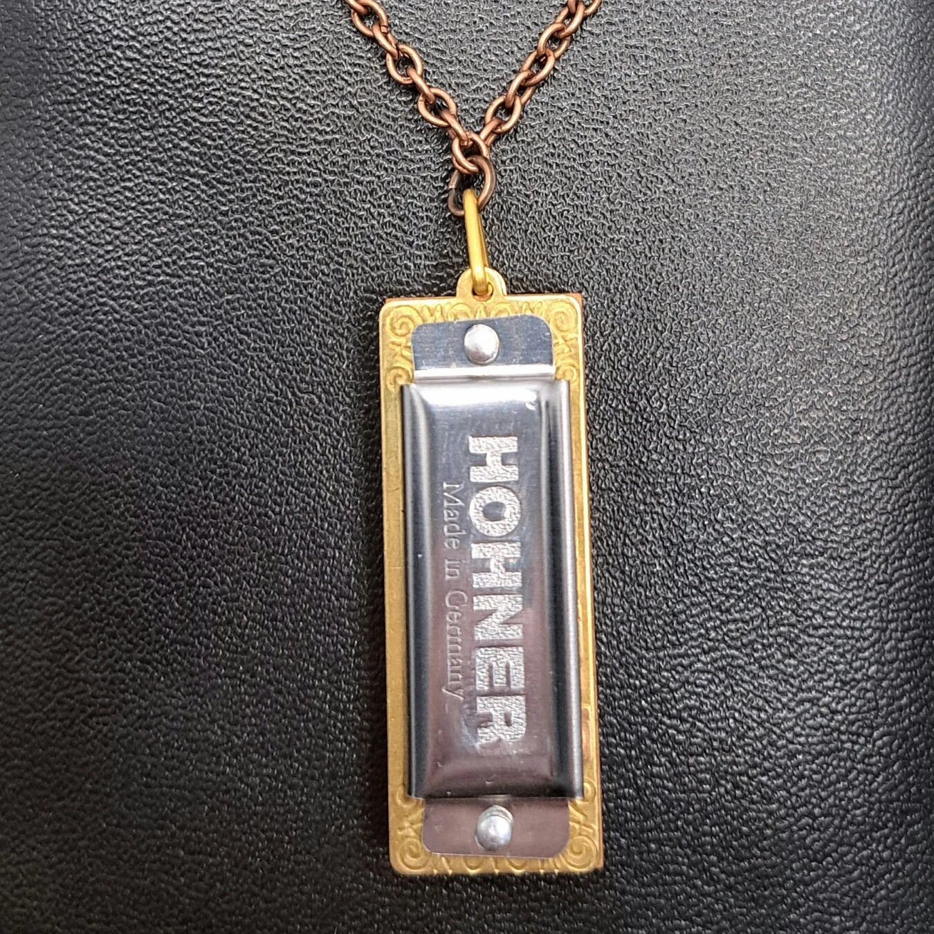 Handmade Harmonica Necklace featuring a playable Hohner Little Lady harmonica on a bronze chain